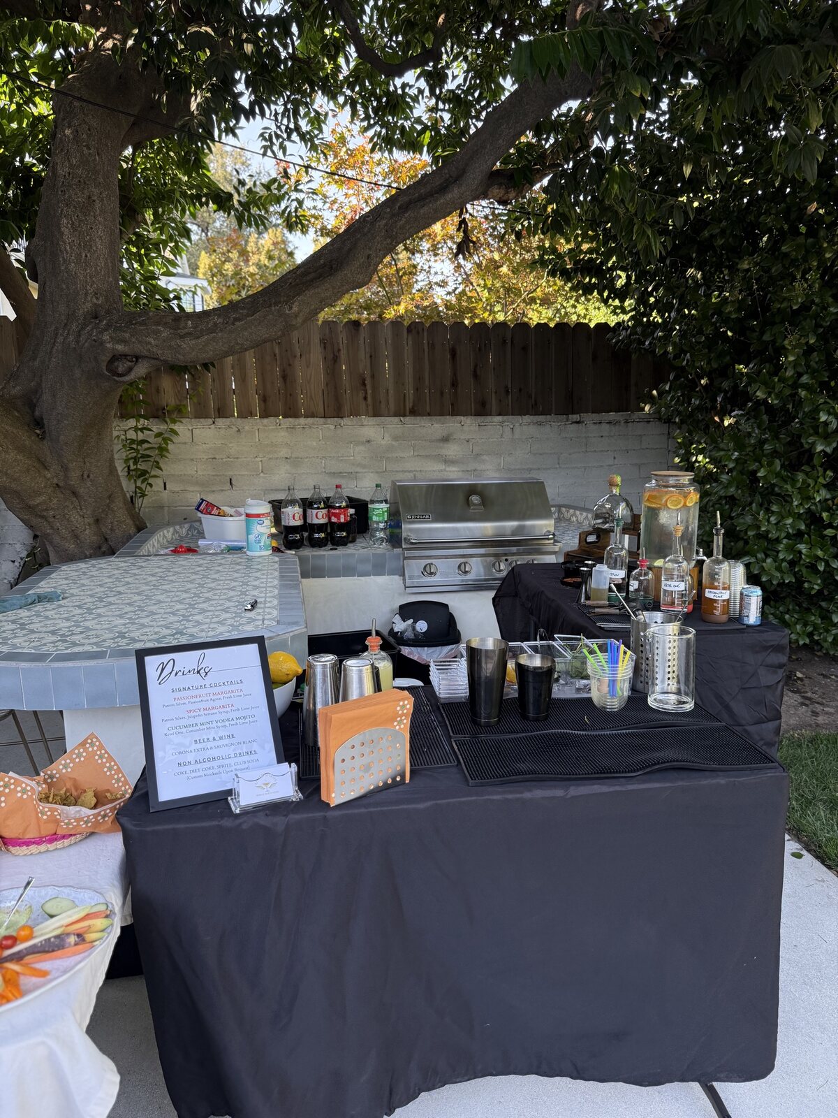 Full Proof event bar setup with menu display and cocktail service details.