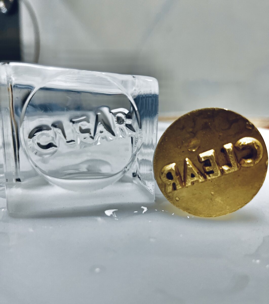 Stamped clear ice for craft cocktail catering.