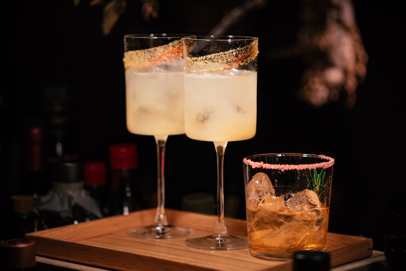 Polished cocktails on a luxury bar tray.