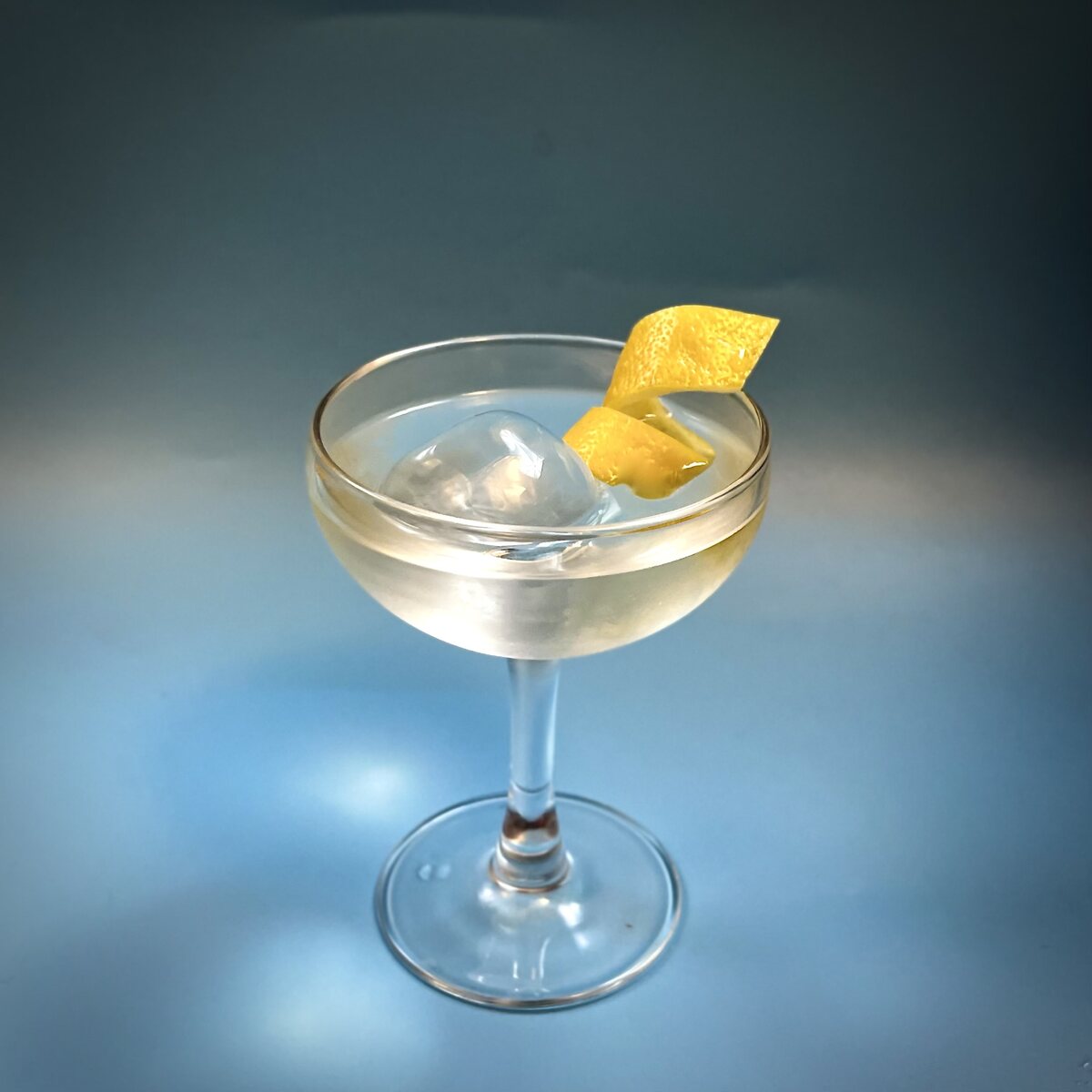 Cocktail served over a clear ice sphere.