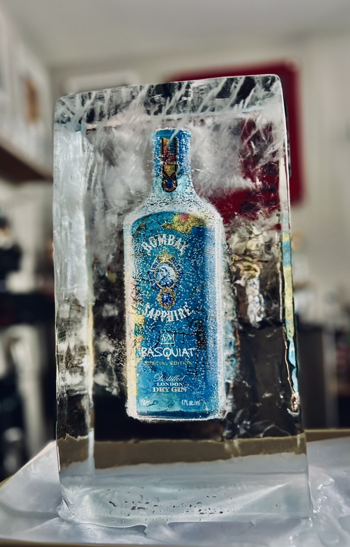 Bombay Sapphire bottle frozen inside a large clear ice block for a custom event moment