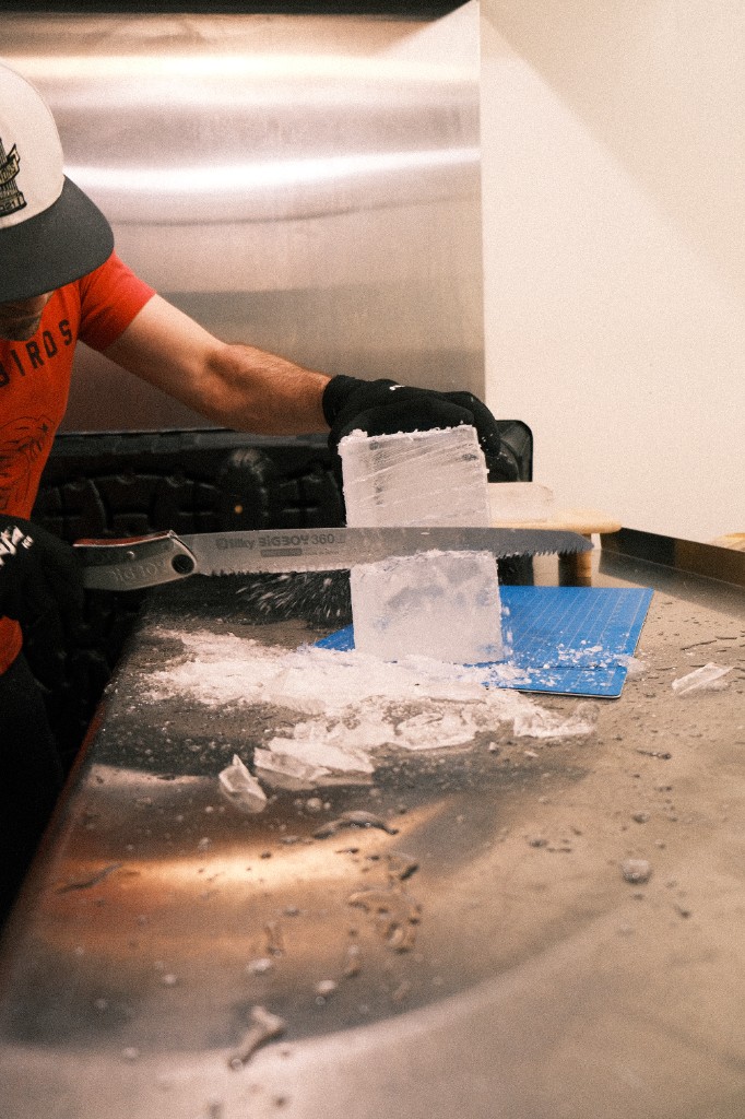 Shaping a large-format clear ice block during Full Proof clear ice production
